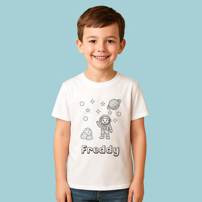 Child wearing a white t-shirt with space-themed graphics and the name 'Freddy' on a light blue background