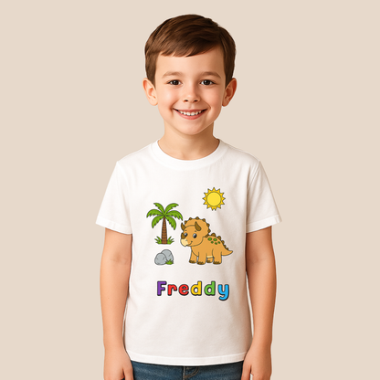 Child wearing a white t-shirt with a dinosaur graphic and the name 'Freddy' on a beige background