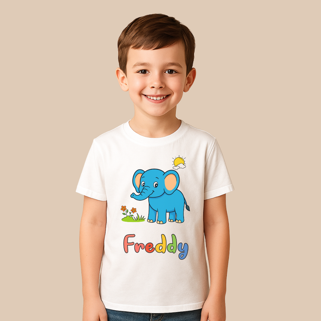 Child wearing a white t-shirt with a blue elephant graphic and 'Freddy' text on a beige background
