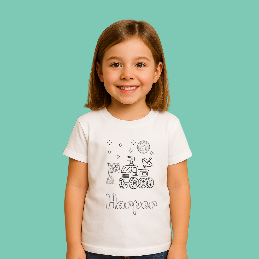 Young girl wearing a white t-shirt with space-themed designs and the name 'Harper' on a teal background