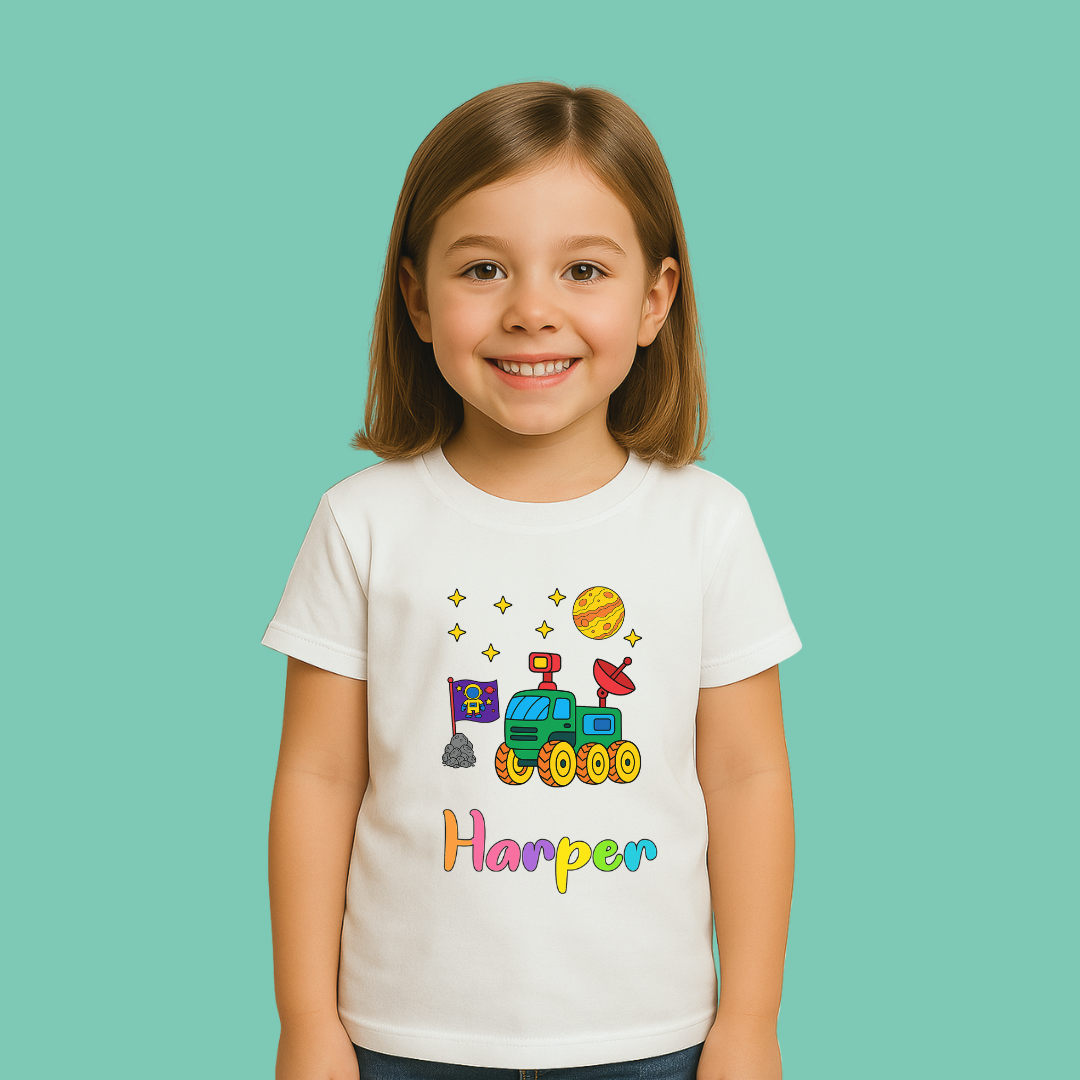 Child wearing a white t-shirt with colorful graphics and the name 'Harper' on a teal background