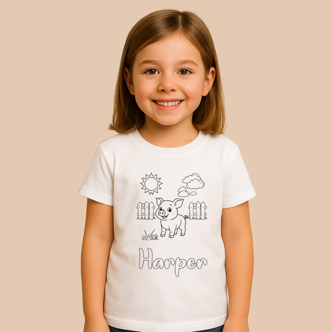 Young girl wearing a white t-shirt with a pig illustration and 'Harper' text on a beige background