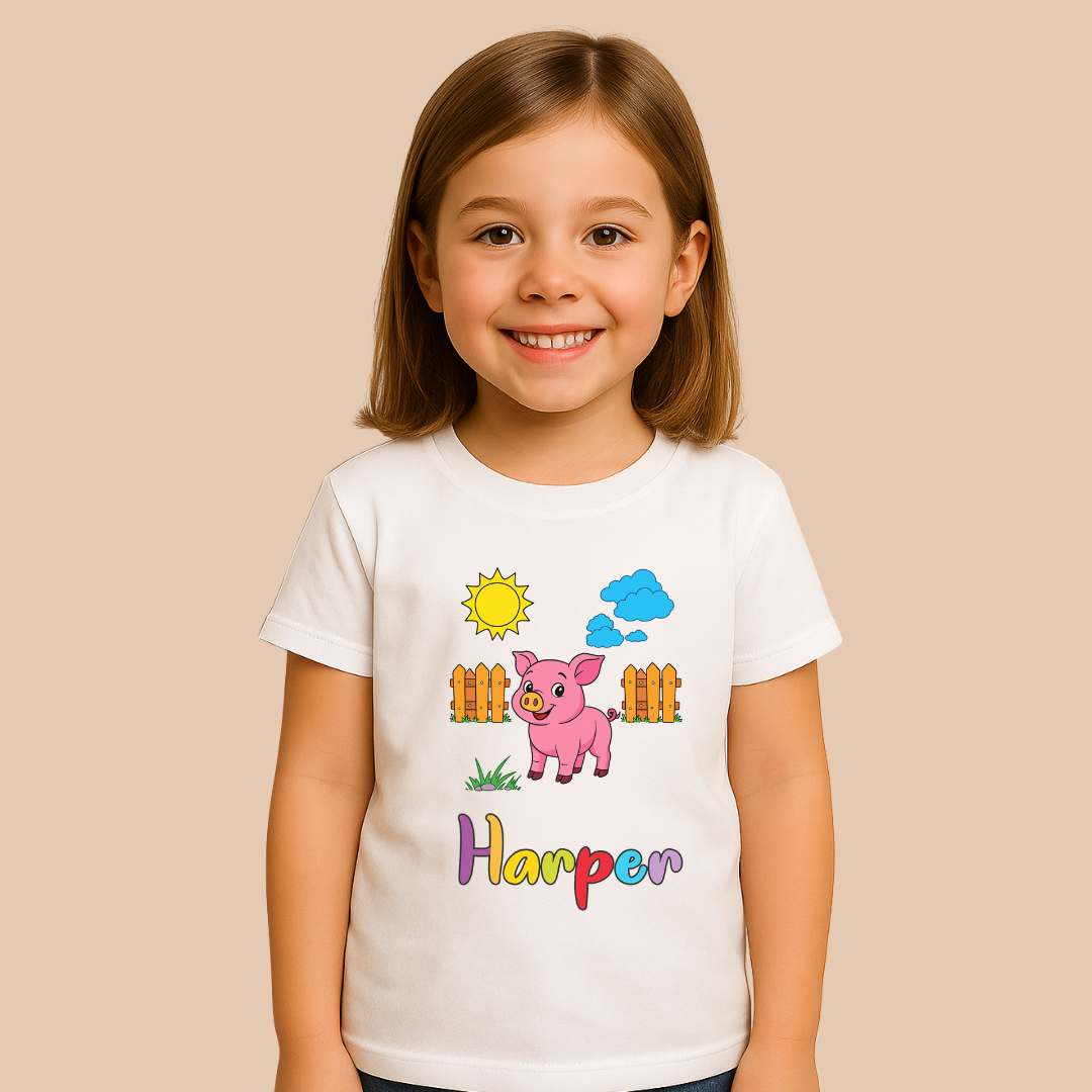 Young girl wearing a white t-shirt with a cartoon pig design and the name 'Harper' on a beige background