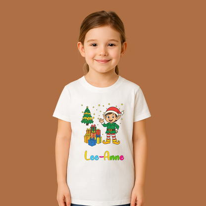 Child wearing a white t-shirt with a Christmas-themed design and name 'Lee-Anne' on a brown background