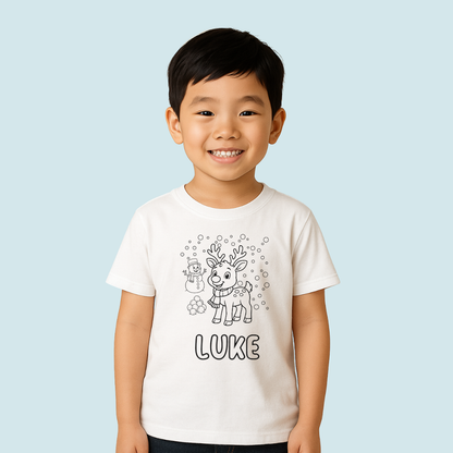 Child wearing a white t-shirt with a reindeer design and 'LUKE' text on a light blue background