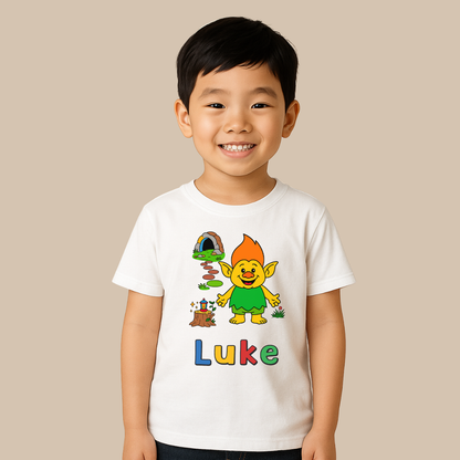 Child wearing a white t-shirt with a colorful character and the name 'Luke' on a beige background