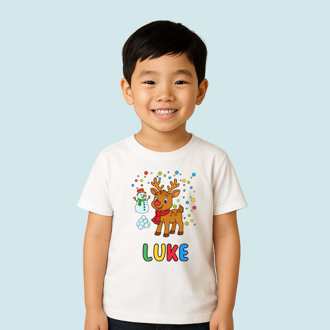 Child wearing a white t-shirt with a reindeer and snowman design, and the name 'LUKE' on a light blue background.