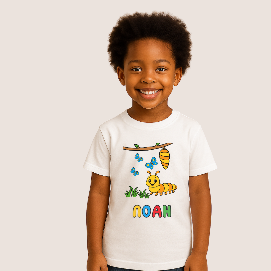 Child wearing a white t-shirt with a caterpillar design and the name 'Noah' on a plain background
