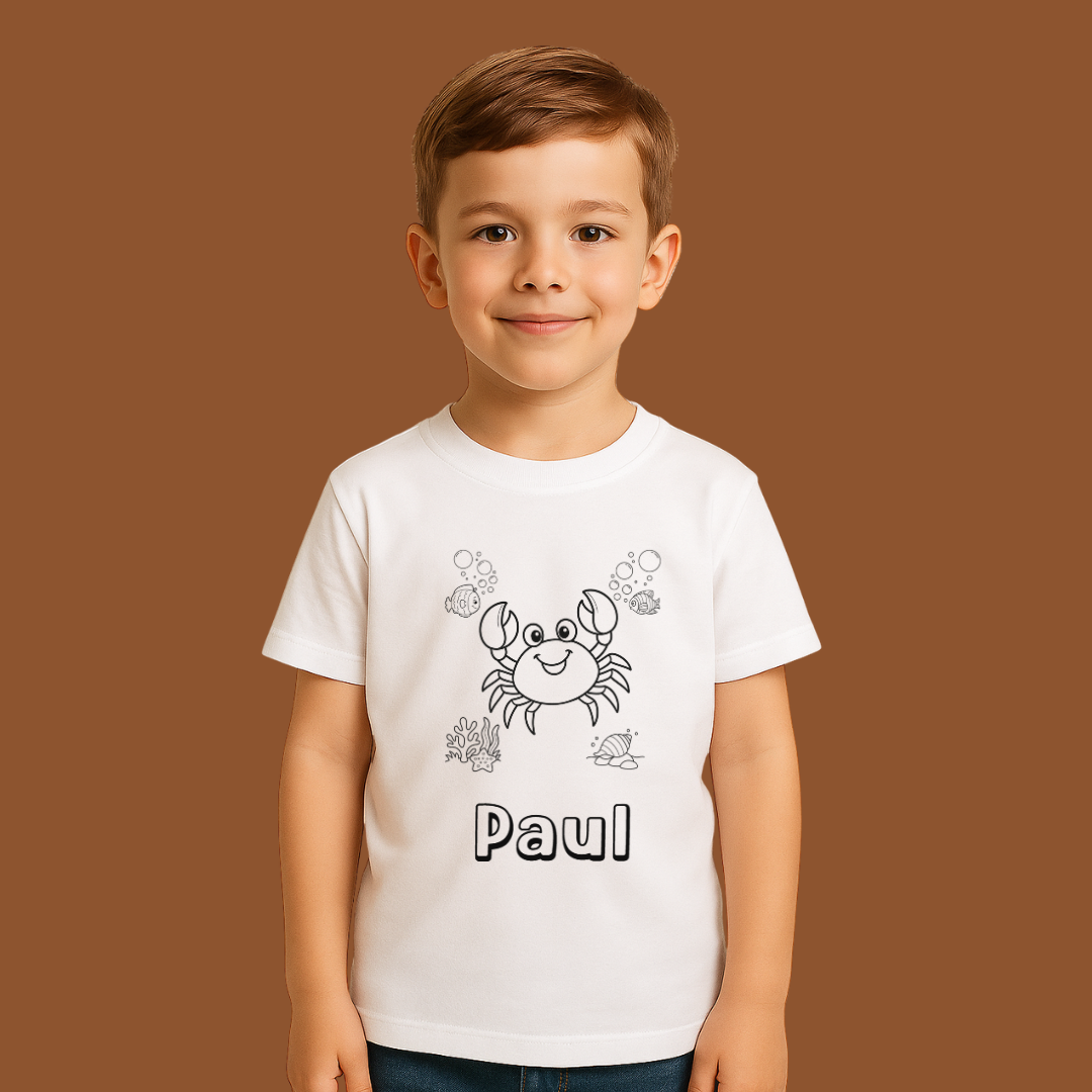 Child wearing a white t-shirt with a crab design and the name 'Paul' on a brown background