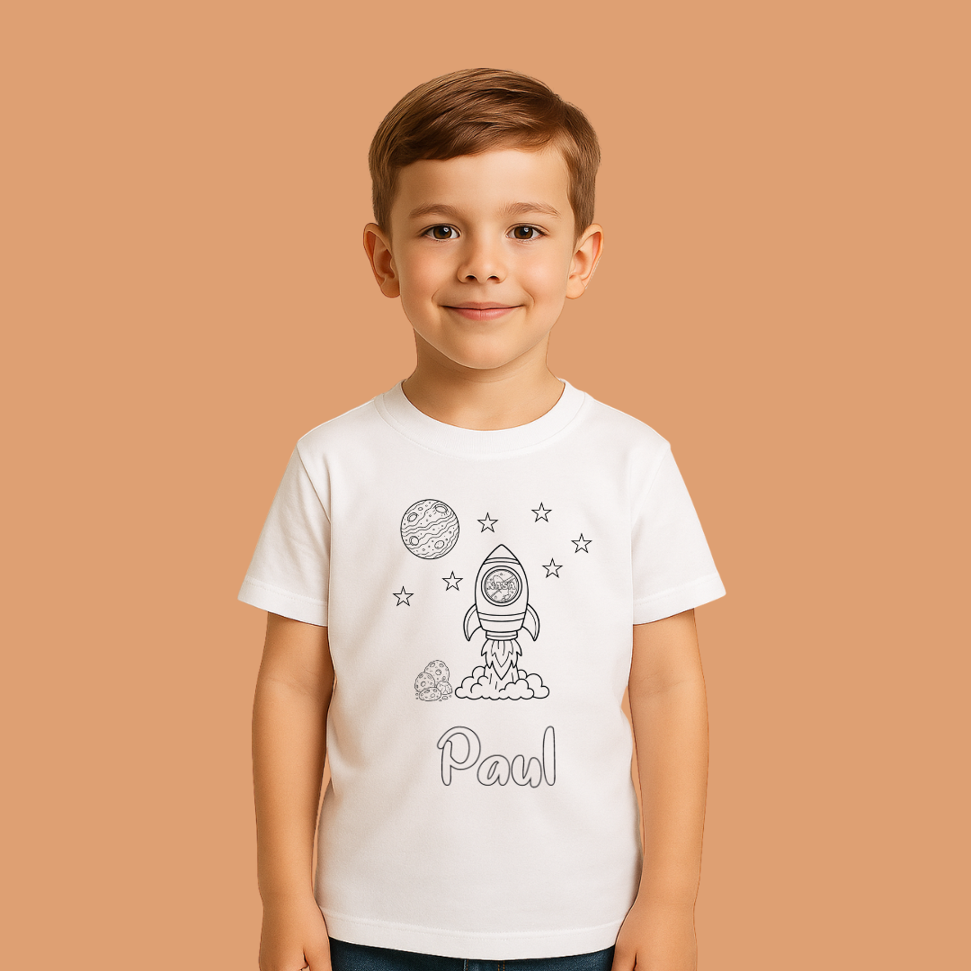 Child wearing a white t-shirt with space-themed graphics and the name 'Paul' on a beige background