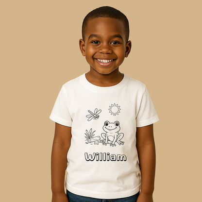 Child wearing a white t-shirt with a frog design and the name 'William' on a beige background