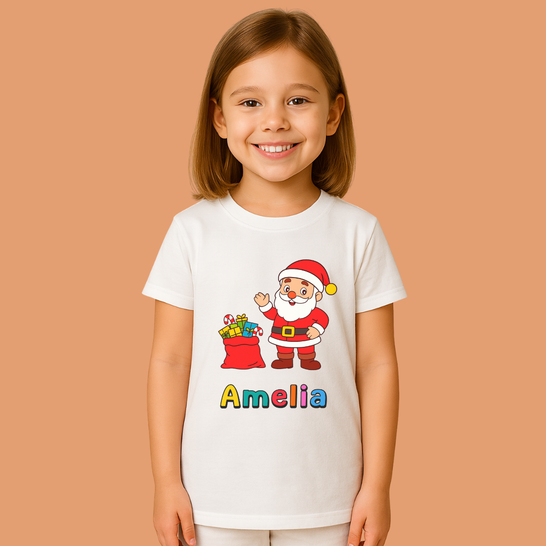 Child wearing a white t-shirt with a Santa Claus graphic and the name 'Amelia' on a beige background