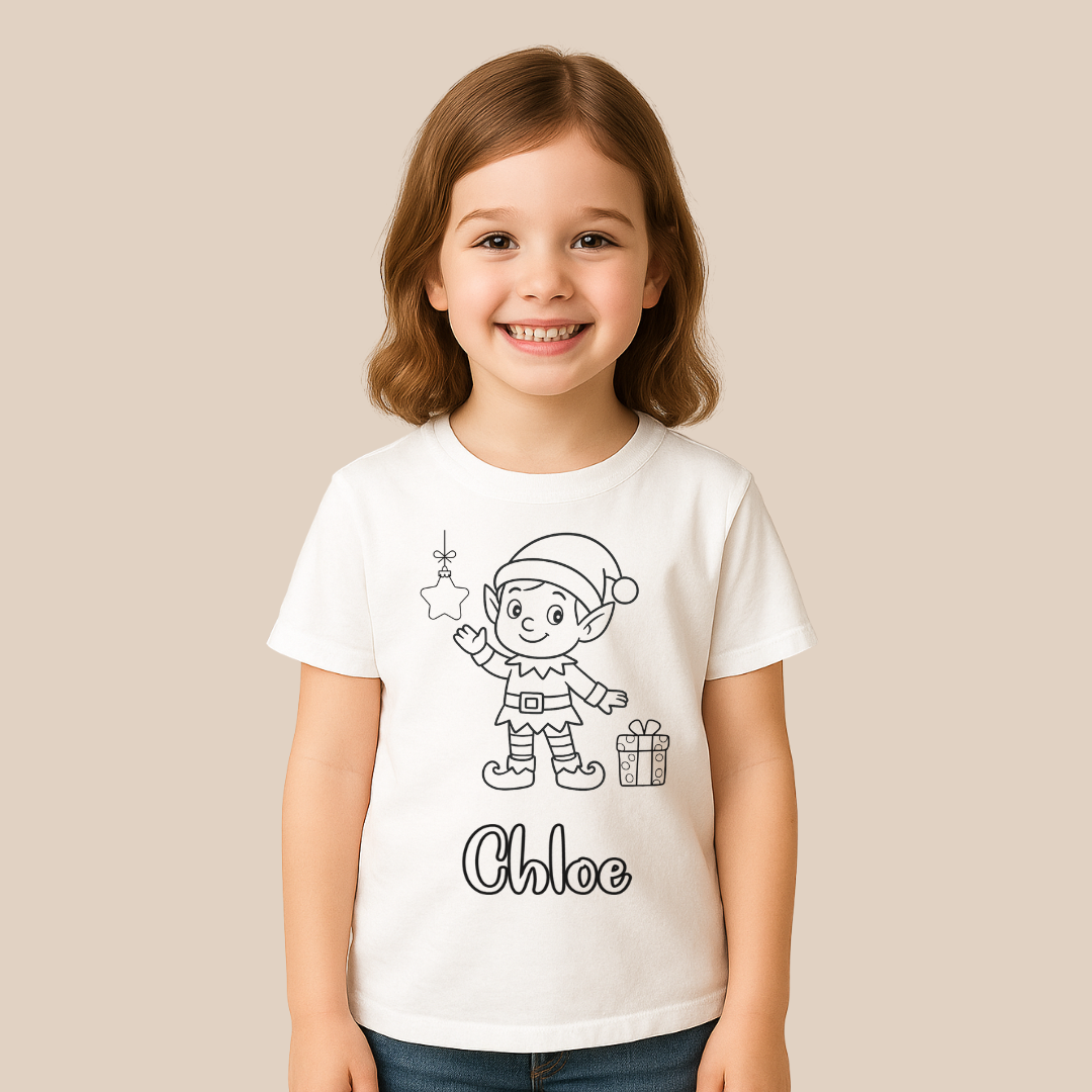 Child wearing a white t-shirt with a Christmas elf design and the name 'Chloe' on a beige background