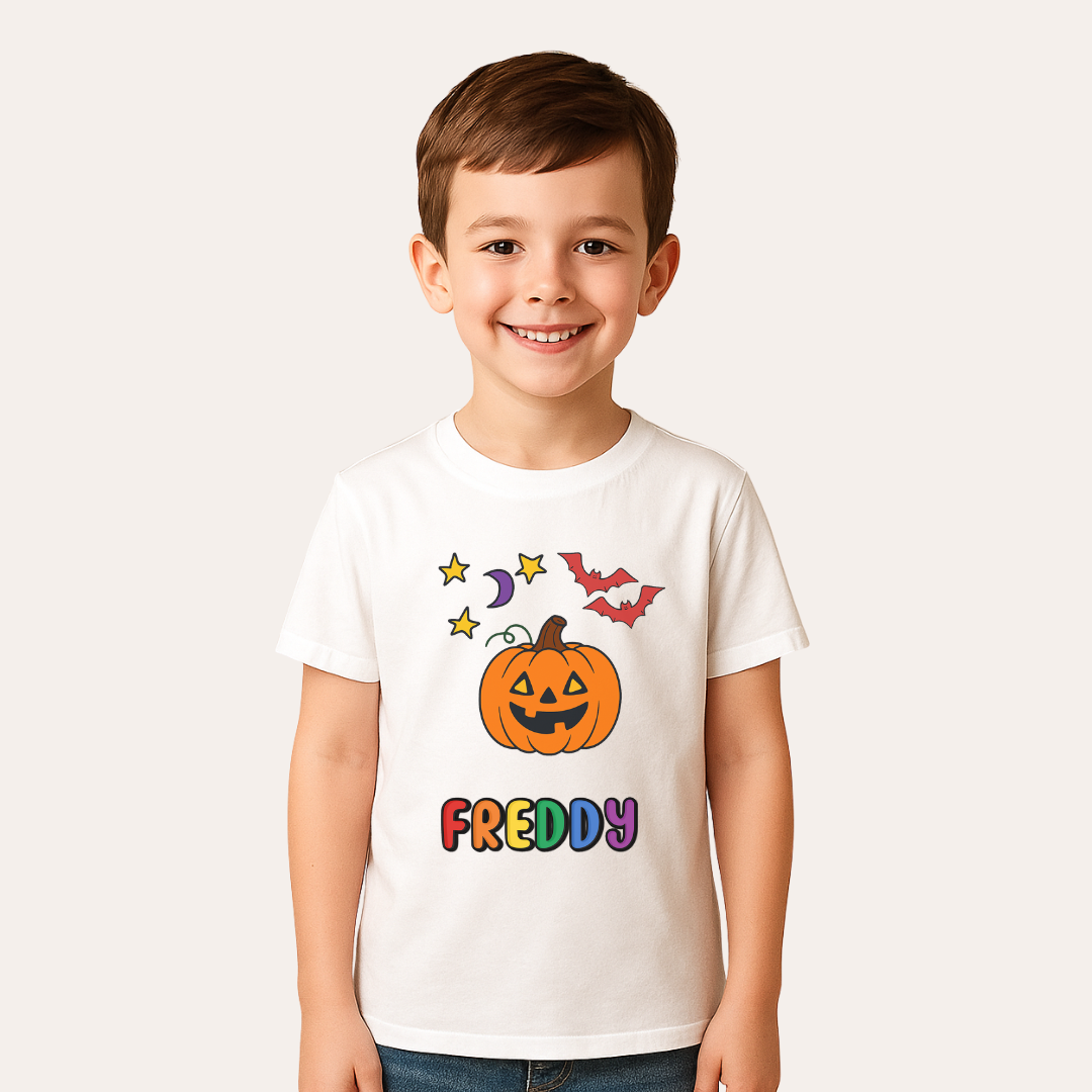 Child wearing a white t-shirt with Halloween-themed design and name 'Freddy'.