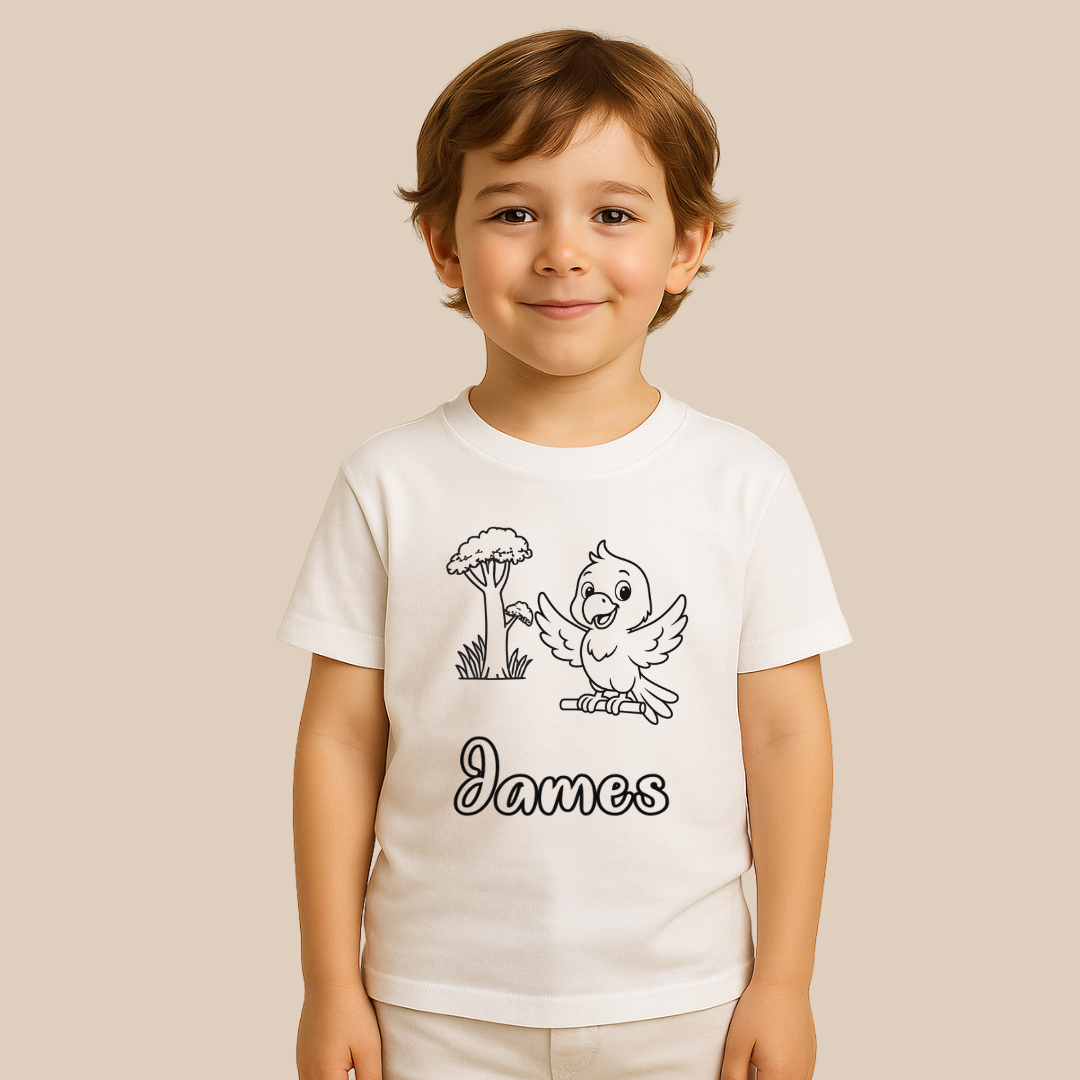 Child wearing a white t-shirt with a cartoon design and the name 'James' on a beige background