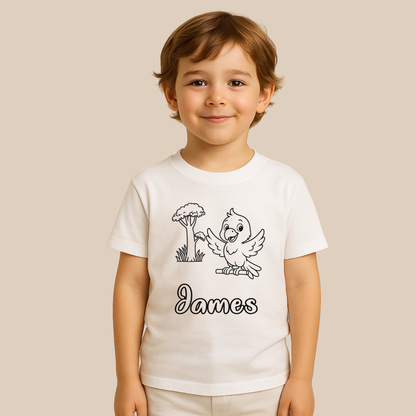 Child wearing a white t-shirt with a cartoon design and the name 'James' on a beige background