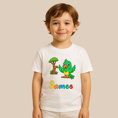 Child wearing a white t-shirt with a colorful bird graphic and the name 'James' on a beige background