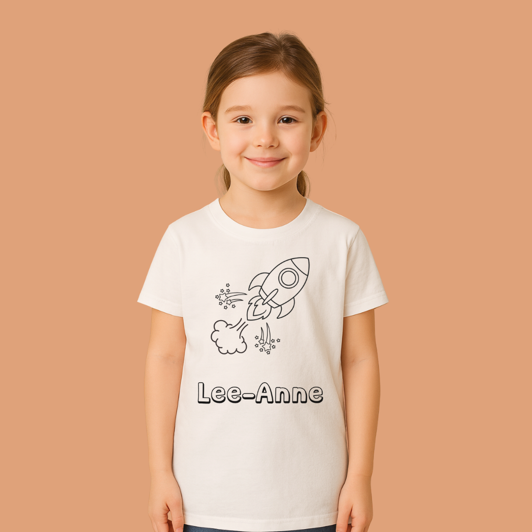 Young girl wearing a white t-shirt with a rocket design and 'Lee-Anne' text on a beige background