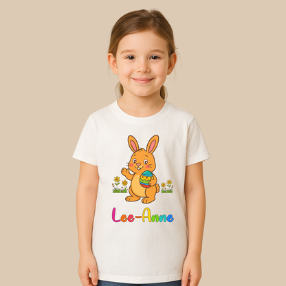 Child wearing a white t-shirt with a colorful bunny design and 'Lee-Anne' text on a beige background