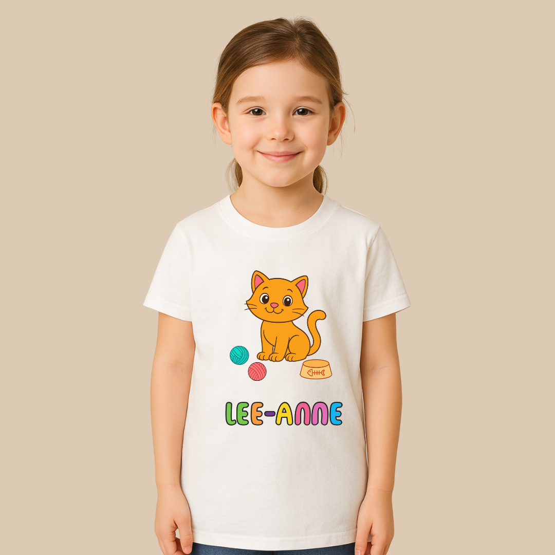 Child wearing a white t-shirt with a cartoon cat and colorful text on a beige background