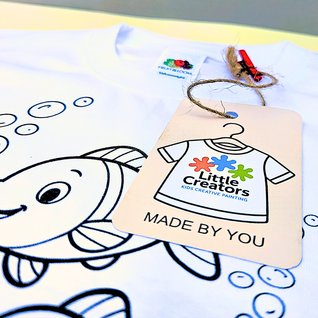 Children's coloring in image with a shirt tag featuring 'Little Creators' branding