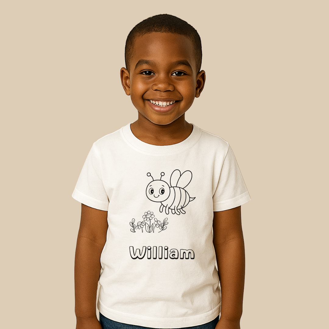 Child wearing a white t-shirt with a bee design and the name 'William' on a beige background