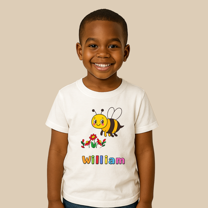 Child wearing a white t-shirt with a bee design and the name 'William' on a beige background